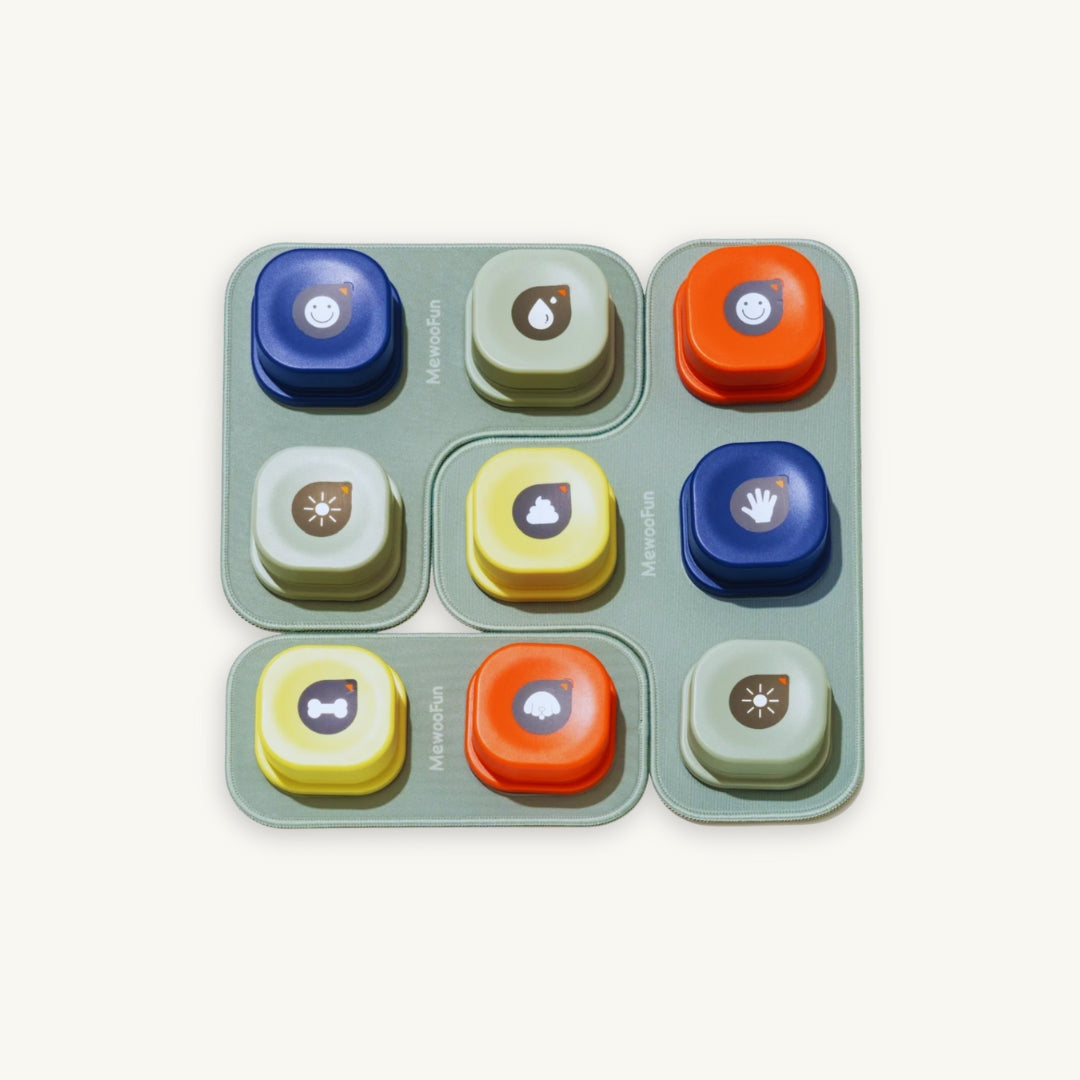 Set of colorful recording buttons with icons arranged in a grid with a modular mat layout.